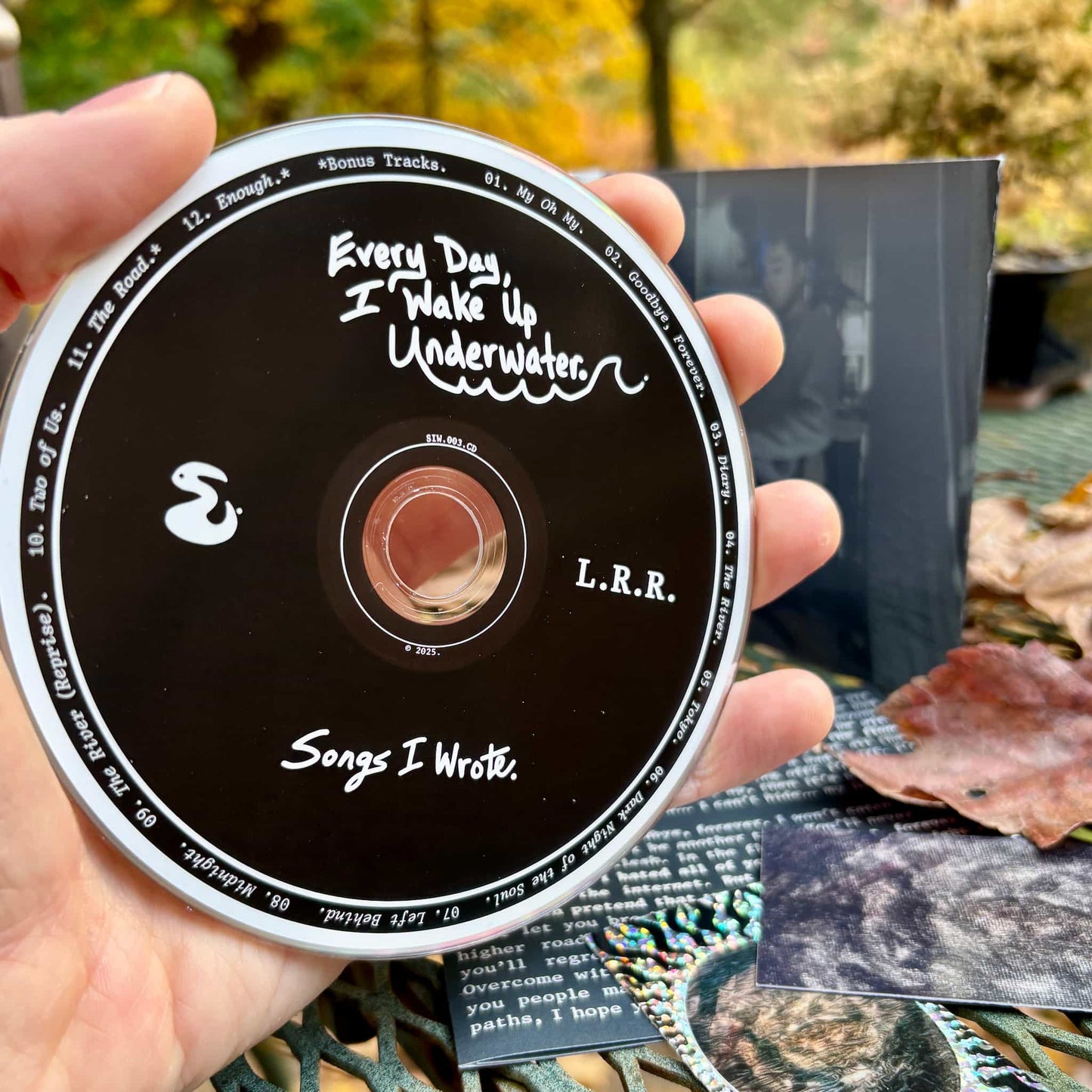 "Underwater" CD disc in hand.