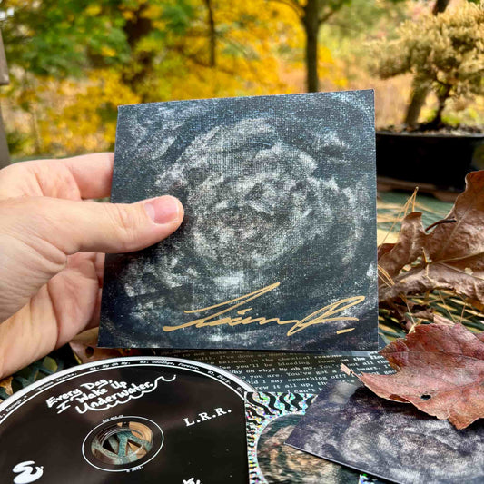 "Every Day, I Wake Up Underwater" front of CD wallet w/ autograph.
