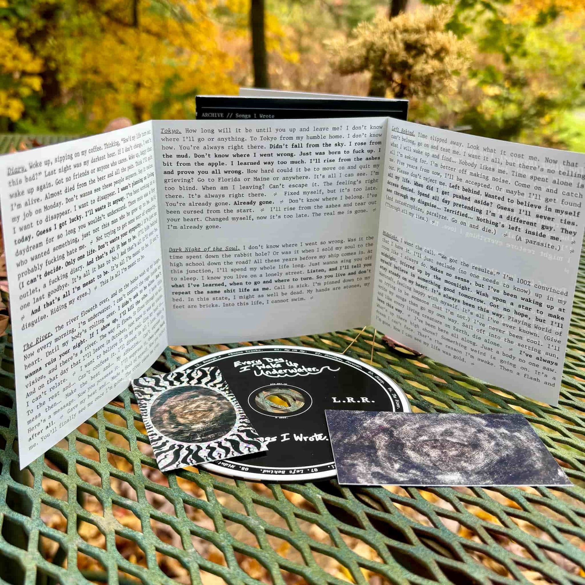 6-panel lyric insert included with the "Underwater" album bundle.