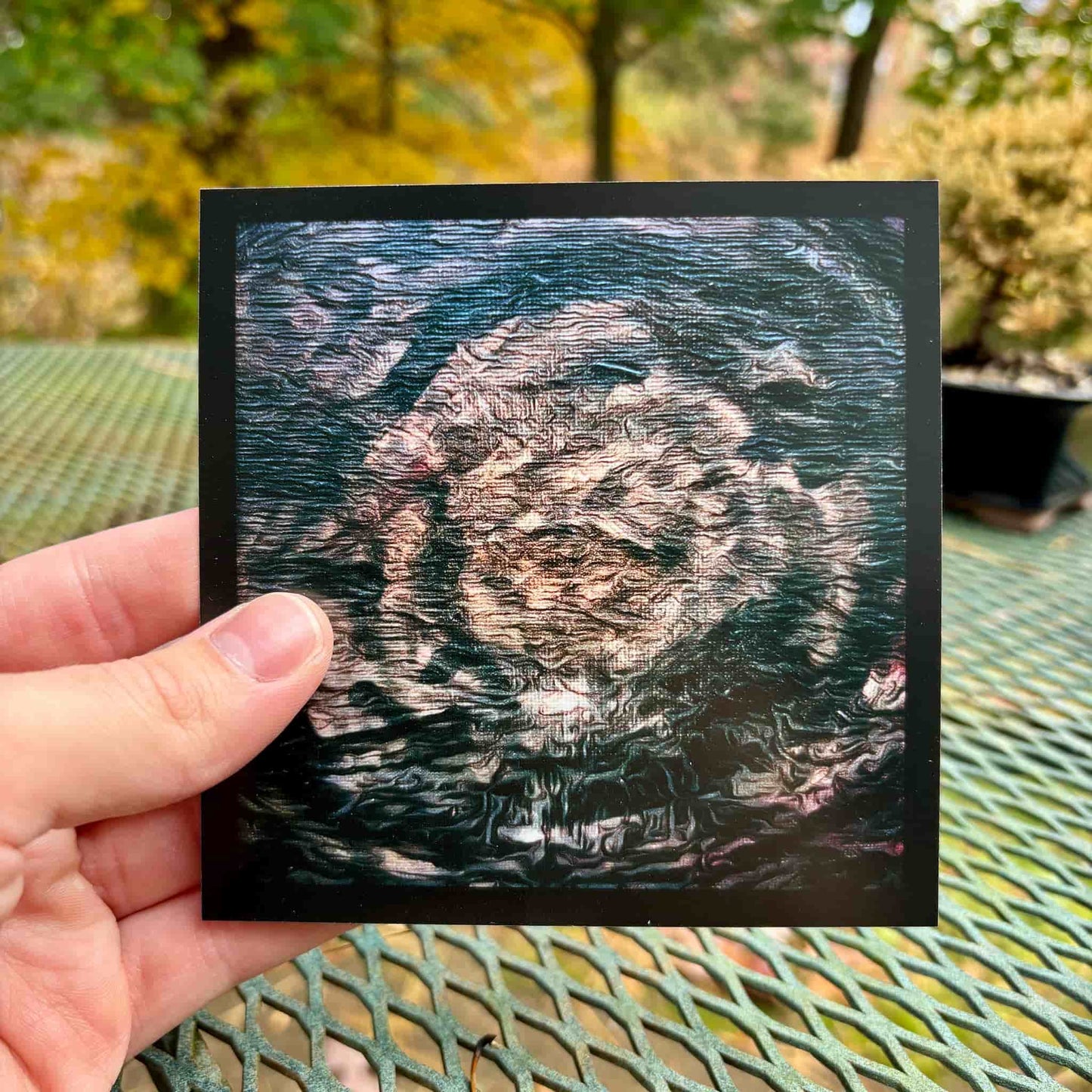 Mini art print in hand.