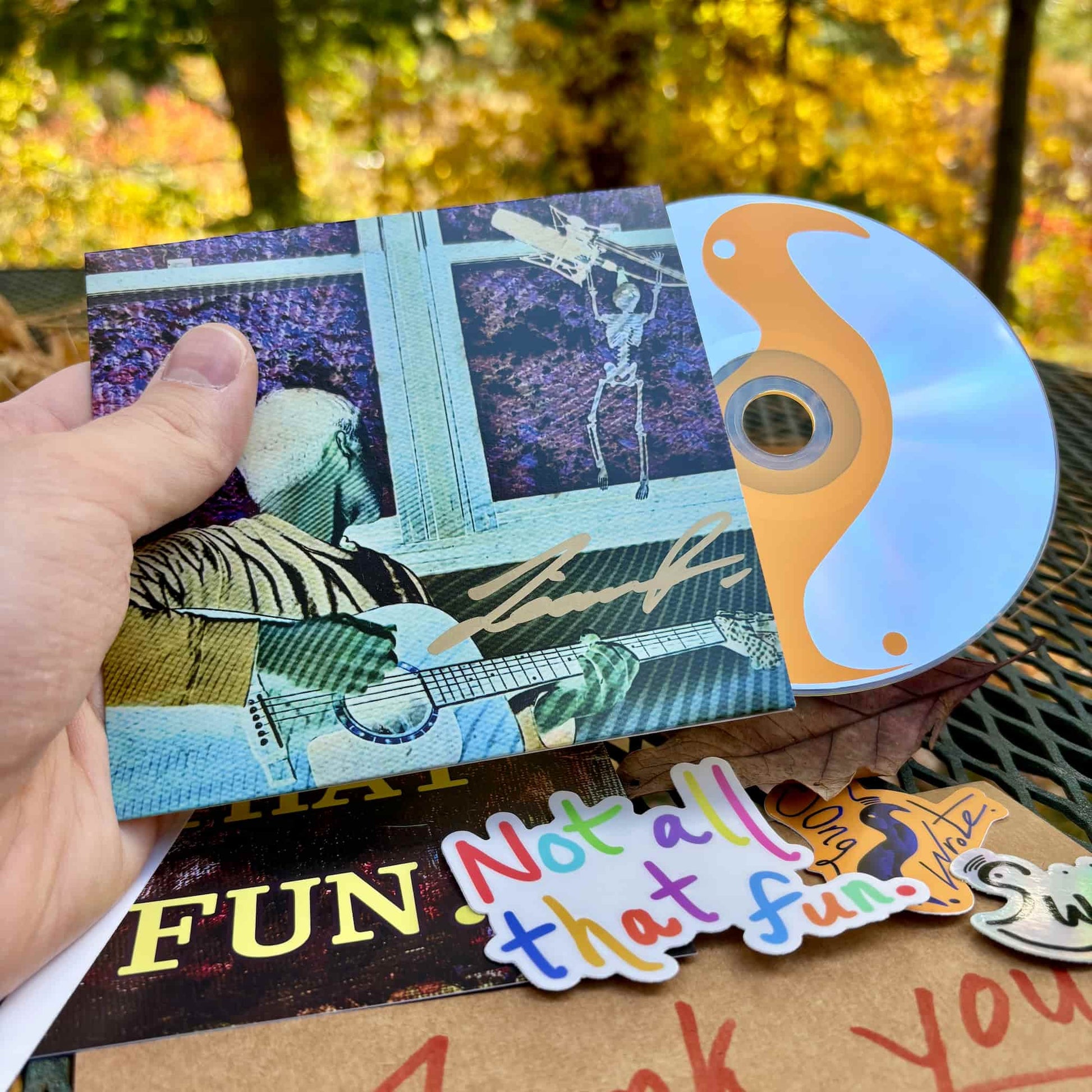 Front of "Every Day, I Wake Up Underwindow" CD package w/ signature.