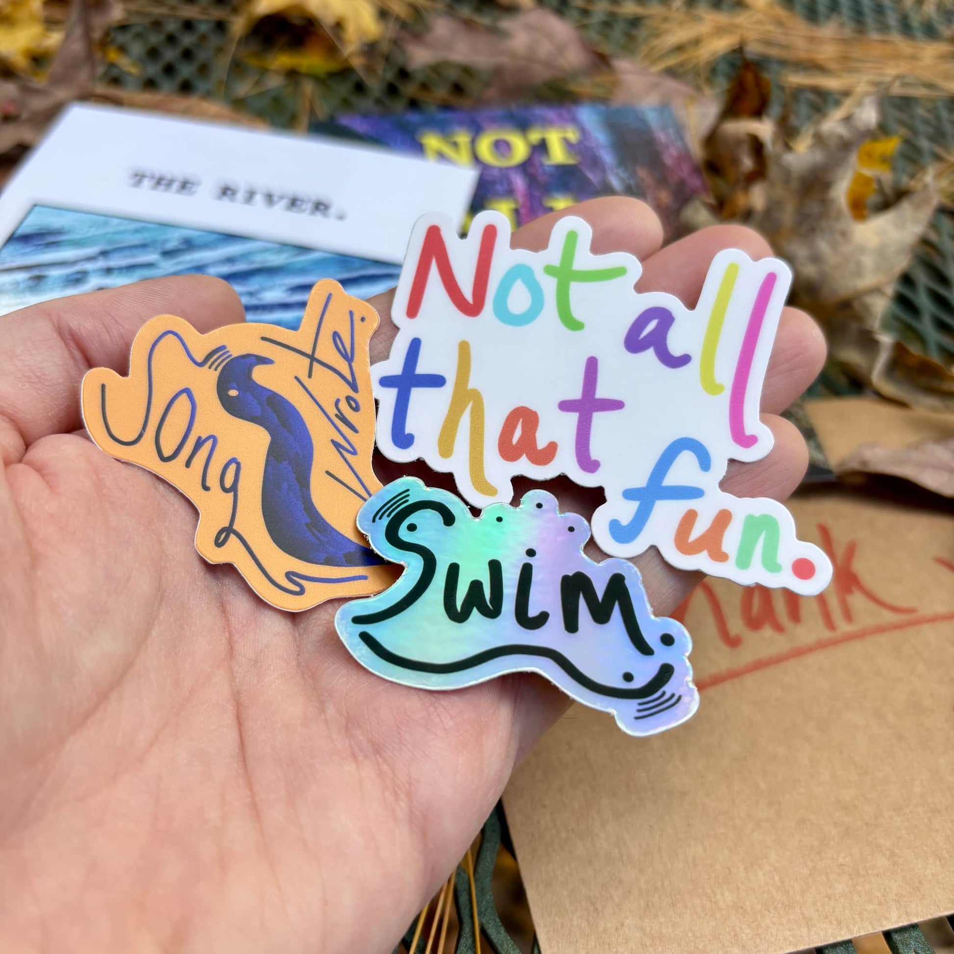 "Underwindow" sticker 3-pack in hand.